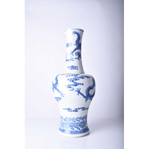 53 - A Chinese blue and white dragon vase, Jiaqing Of baluster form and decorated with three dragons chas... 