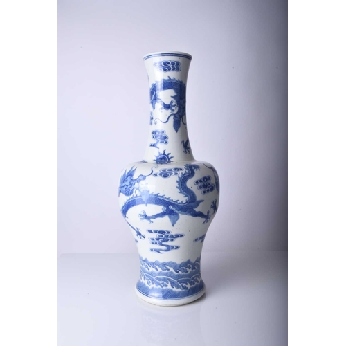 53 - A Chinese blue and white dragon vase, Jiaqing Of baluster form and decorated with three dragons chas... 