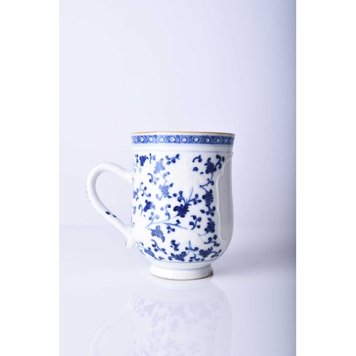 62 - A Chinese blue and white mug, 18th century Of bell form with plain loop handle, decorated with bianc... 