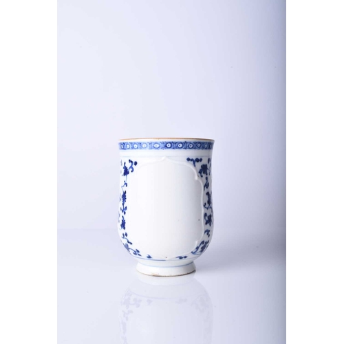 62 - A Chinese blue and white mug, 18th century Of bell form with plain loop handle, decorated with bianc... 