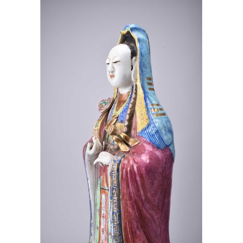 71 - A Chinese famille rose figure of Guanyin, Qing Dynasty, 19th century The Goddess of Mercy modelled b... 