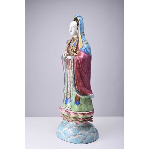 71 - A Chinese famille rose figure of Guanyin, Qing Dynasty, 19th century The Goddess of Mercy modelled b... 