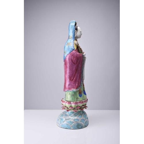 71 - A Chinese famille rose figure of Guanyin, Qing Dynasty, 19th century The Goddess of Mercy modelled b... 