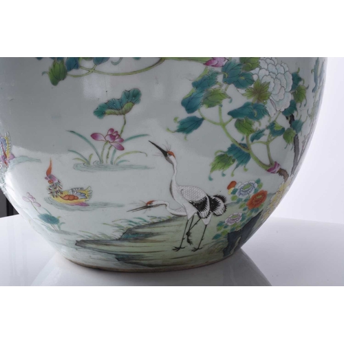 72 - A good Chinese famille rose fish bowl, 18th century Of ovoid form with everted rim, finely painted i... 