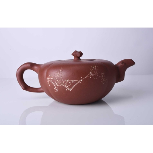 86 - Three Chinese Yixing teapots and covers, 20th century All of compressed ovoid form, the first modell... 