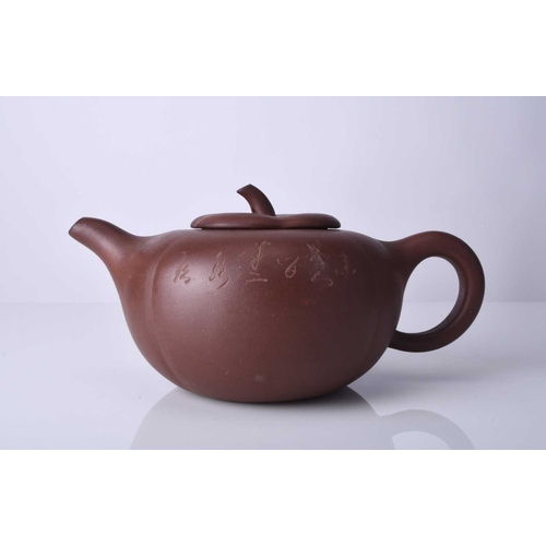 86 - Three Chinese Yixing teapots and covers, 20th century All of compressed ovoid form, the first modell... 