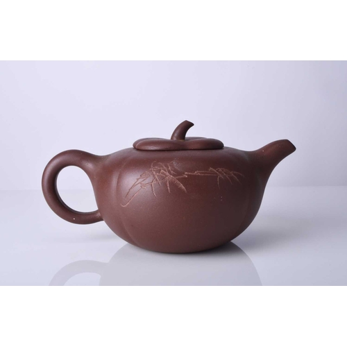 86 - Three Chinese Yixing teapots and covers, 20th century All of compressed ovoid form, the first modell... 