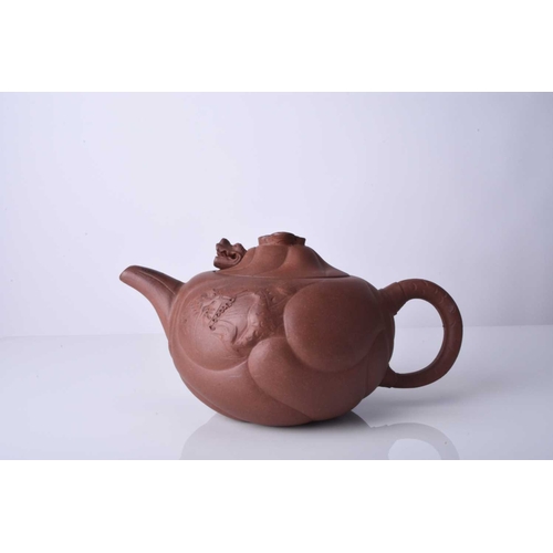 86 - Three Chinese Yixing teapots and covers, 20th century All of compressed ovoid form, the first modell... 