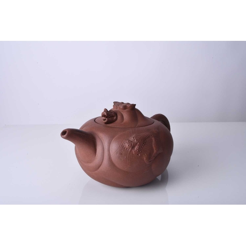 86 - Three Chinese Yixing teapots and covers, 20th century All of compressed ovoid form, the first modell... 