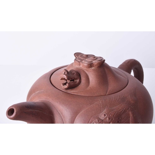 86 - Three Chinese Yixing teapots and covers, 20th century All of compressed ovoid form, the first modell... 