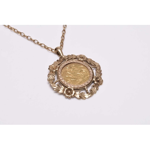 225 - A Victorian half sovereign pendant, dated 1900, within 9ct gold mount and suspended from 9ct gold ch... 