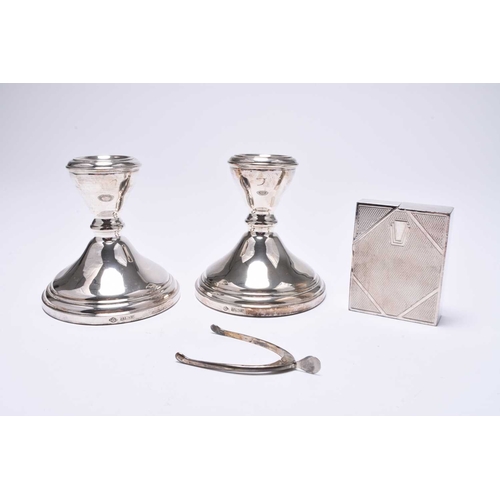 26 - A pair of short silver candlesticks, Adie Brothers, Birmingham 1962, 10.5cm high, together with a pa... 