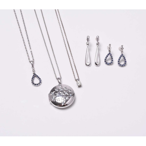 A 9ct white gold circular locket on chain, together with a 9ct white ...