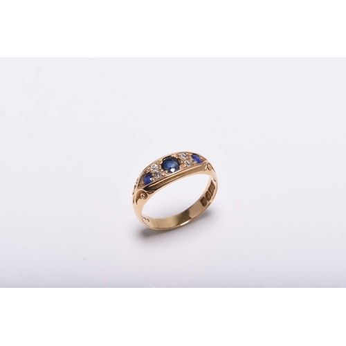 372 - An Edwardian 18ct gold seven stone diamond and untested sapphire ring, the graduated round and oval ... 