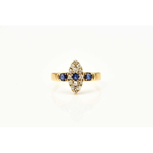 374 - An 18ct gold Edwardian sapphire and diamond ring, designed as a central round cut sapphire claw set ... 