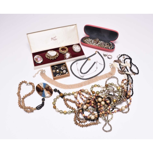 376 - A large collection of costume jewellery, to include; shell cameo brooches, faceted paste set brooche... 