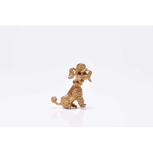 384 - A 9ct gold Poodle brooch, the naturalistically modelled Poodle with faceted stone set eyes, 27mm hig... 