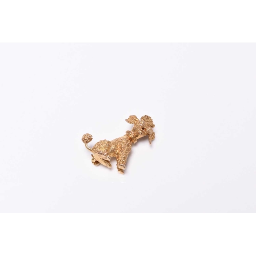 384 - A 9ct gold Poodle brooch, the naturalistically modelled Poodle with faceted stone set eyes, 27mm hig... 