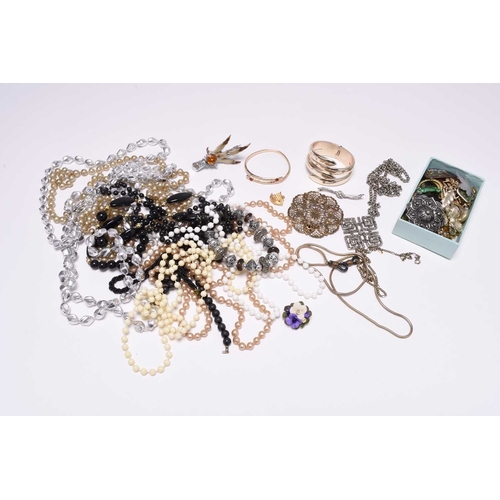 386 - A large collection of costume jewellery, to include; polished agate brooches, a niello panel bracele... 