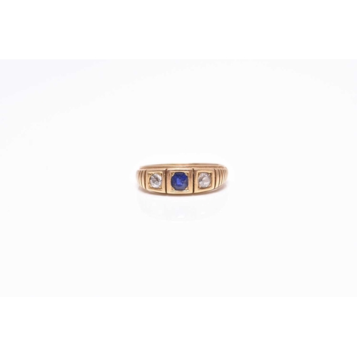 394 - An early 20th century three stone untested sapphire and diamond ring, the shank stamped 18ct, ring... 