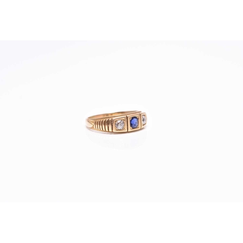 394 - An early 20th century three stone untested sapphire and diamond ring, the shank stamped 18ct, ring... 