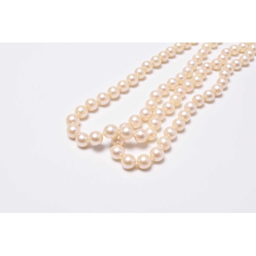 399 - A two strand uniform cultured pearl necklace with diamond set clasp, stamped '9ct' 'Lotus', 35cm lon... 