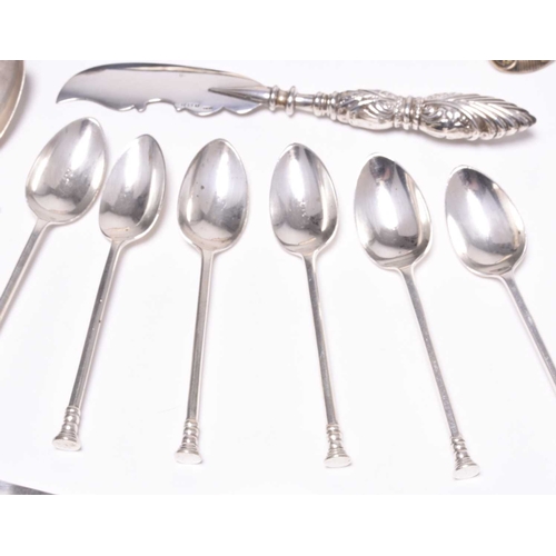 60 - A collection of silver flatware, to include; a pair of George IV Shell and Fiddle pattern sauce ladl... 