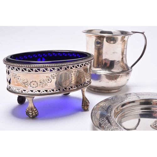 9 - A George III oval silver salt, makers mark rubbed, London 1781, with blue glass liner, together with... 