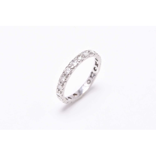 29 - A diamond eternity ring, the brilliant cut diamonds claw set in white metal, ring size M, weight app... 