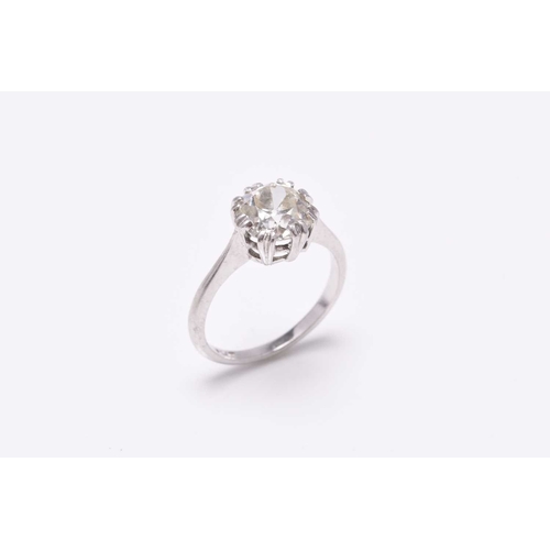 31 - A single stone diamond ring, the cushion cut diamond claw set in white metal to white metal shank, s... 