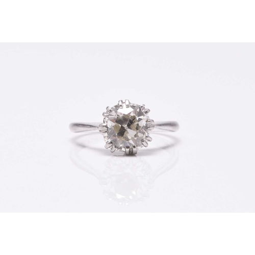 31 - A single stone diamond ring, the cushion cut diamond claw set in white metal to white metal shank, s... 