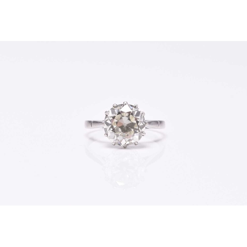 32 - A single stone diamond ring, the old cut diamond claw set in white metal to white metal shank, indis... 