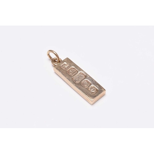 44 - A 9ct gold diamond set ingot pendant, the rectangular yellow gold ingot set with eight round brillia... 