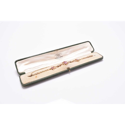 45 - An early 20th century pink tourmaline and seed pearl bracelet, designed as a central octagonal facet... 