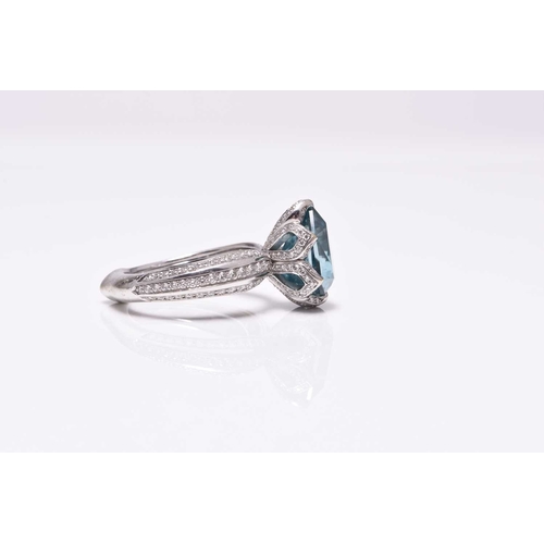 50 - An 18ct white gold blue zircon and diamond ring by Kat Florence, designed as a central pear cut blue... 