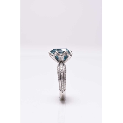 50 - An 18ct white gold blue zircon and diamond ring by Kat Florence, designed as a central pear cut blue... 