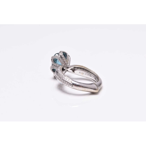 50 - An 18ct white gold blue zircon and diamond ring by Kat Florence, designed as a central pear cut blue... 