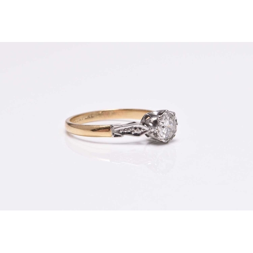 59 - A single stone diamond ring, the brilliant cut diamond illusion set in white metal to yellow metal s... 