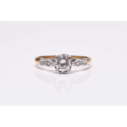 59 - A single stone diamond ring, the brilliant cut diamond illusion set in white metal to yellow metal s... 