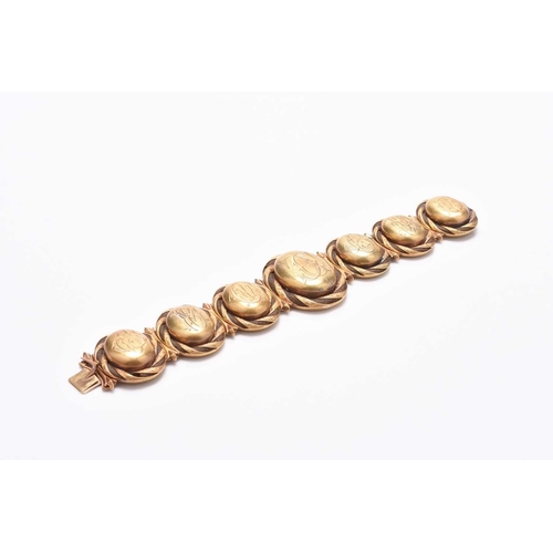 60 - A 19th century woven hair graduated locket bracelet, designed as seven yellow metal oval graduated l... 