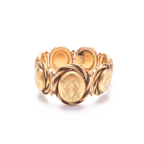 60 - A 19th century woven hair graduated locket bracelet, designed as seven yellow metal oval graduated l... 