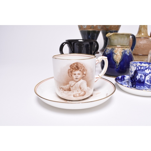 106 - An assorted collection of pottery and porcelain, 19th century and later, including a Jackfield-type ... 