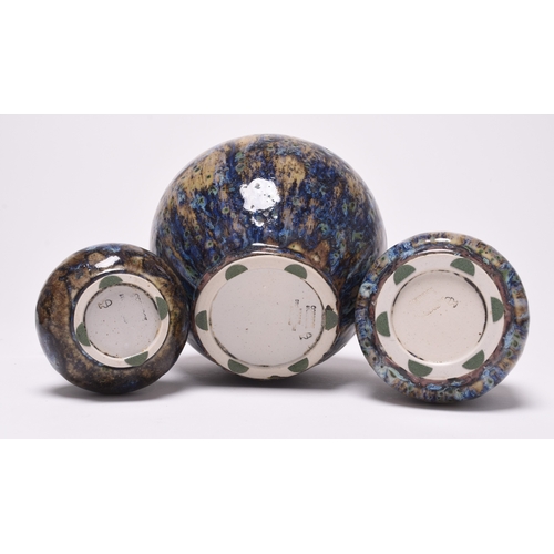 123 - Three Cobridge stoneware vases, dated 2001, decorated with mottled blue, purple and brown glazes, im... 