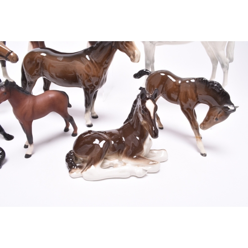 126 - A group of Beswick horses, including a Hackney pony, model H261; a matt glaze Shire Horse, two Hunts... 