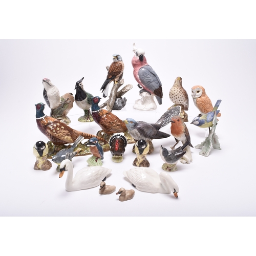 132 - A group of models of birds, comprising Beswick birds: a Lesser Spotted Woodpecker, a Thrush, a Lapwi... 