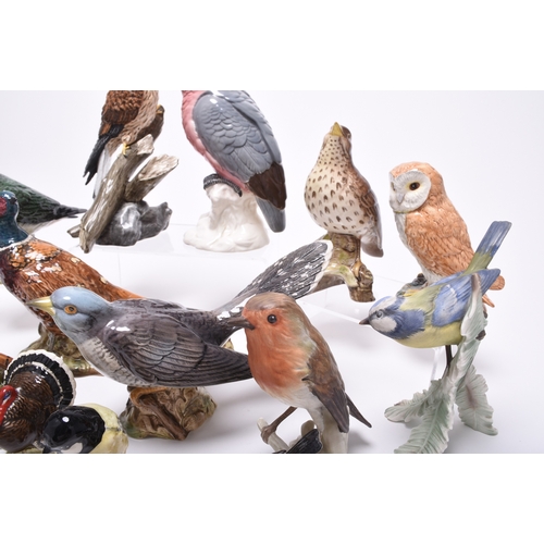 132 - A group of models of birds, comprising Beswick birds: a Lesser Spotted Woodpecker, a Thrush, a Lapwi... 