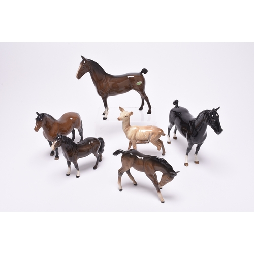 133 - A collection of Beswick models of animals, comprising two sheep and a dog, two mice, a donkey, a fam... 