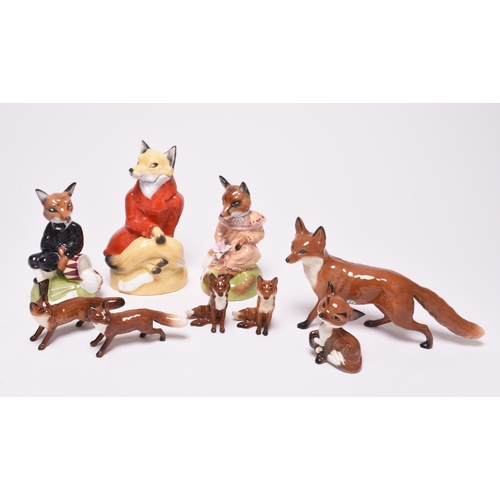 134 - A group of figures of foxes, comprising three Royal Stratford figures, Lady Fox, Male Fox and Huntin... 