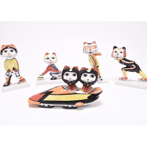 169 - A set of five Lorna Bailey 'Winter Olympic Sports' cat figures, comprising skier, skater, curler, wi... 