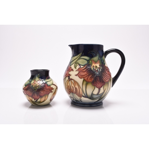 185 - A contemporary Moorcroft jug and vase in the 'Anna Lily' pattern, printed and painted marks, 8cm and... 